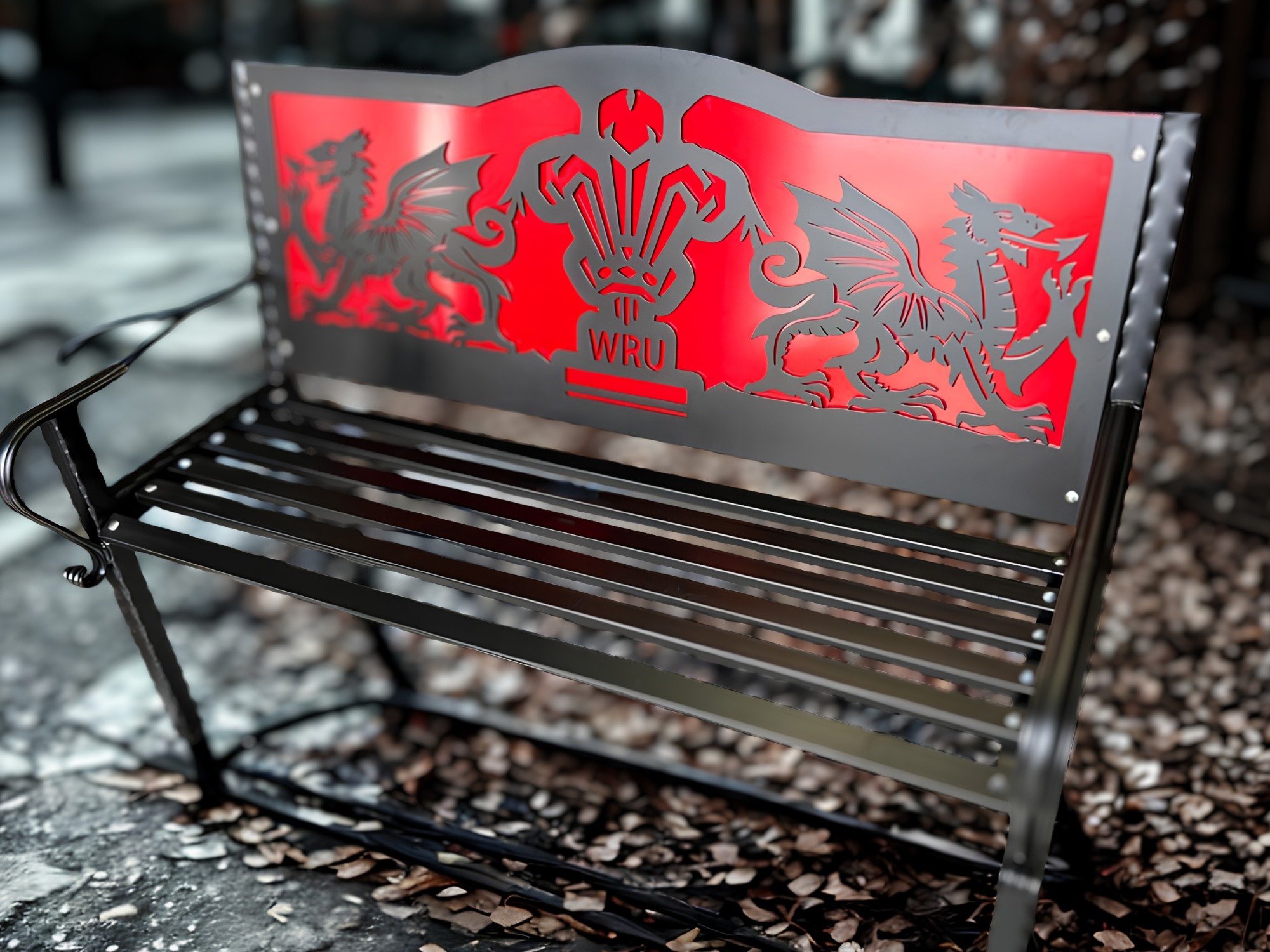 Laser‑cut steel bench with Welsh Rugby Union dragon design