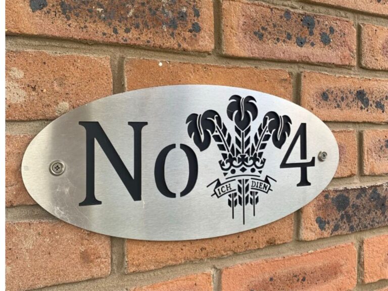 Metal house number plaque with Prince of Wales feathers and Ich Dien emblem