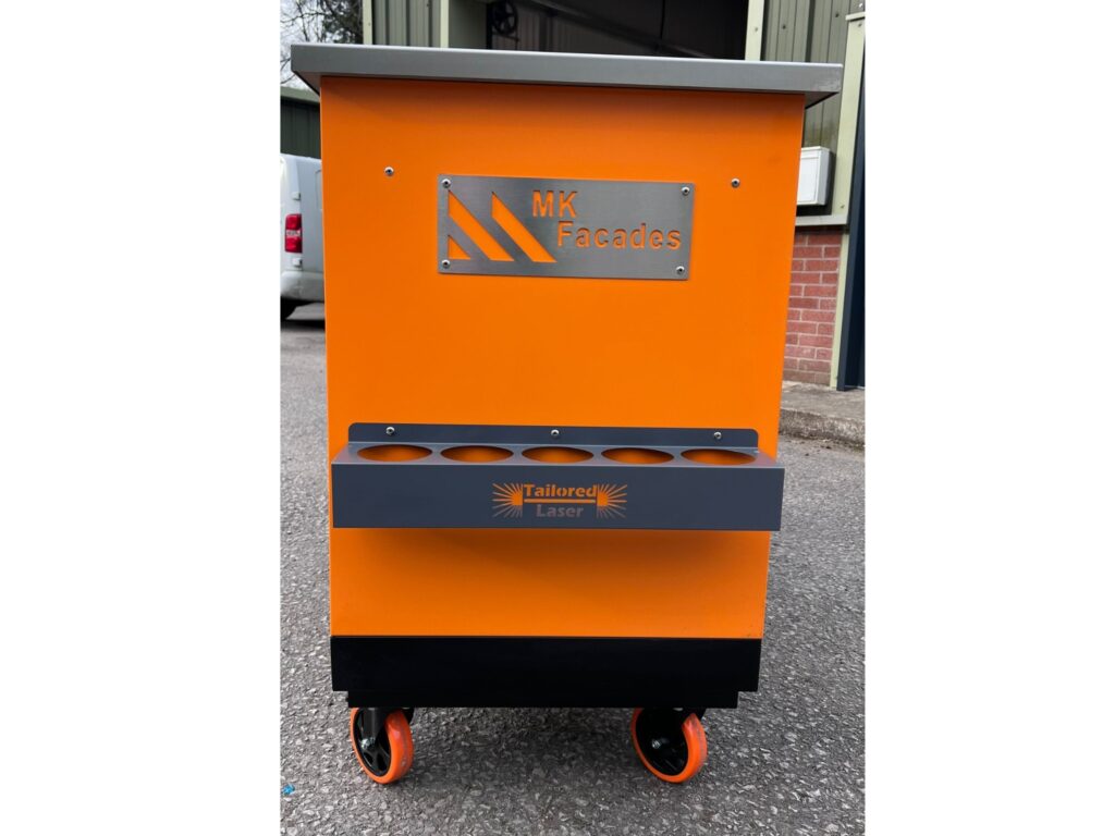 Orange mobile workshop unit with MK Facades and Tailored Laser branding and tool holders