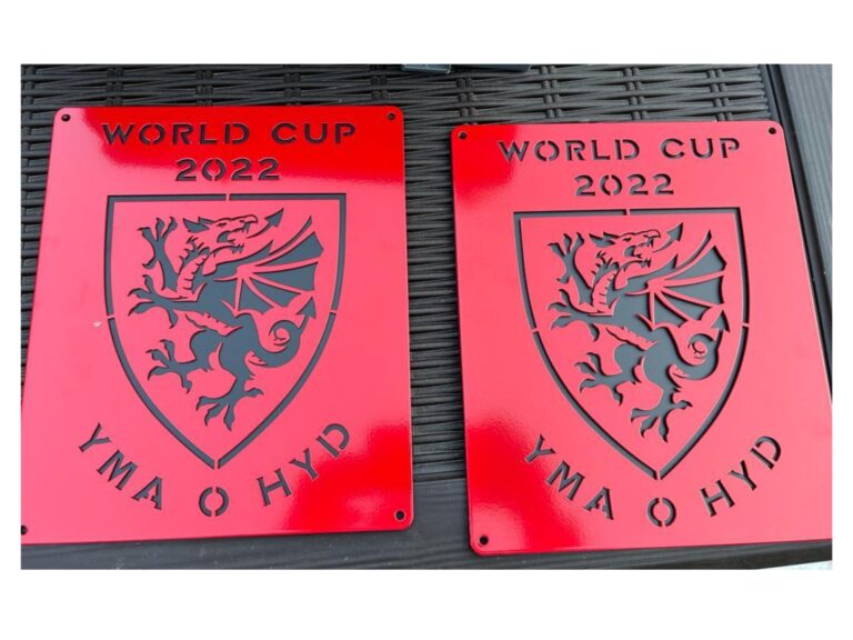 Red metal plaque with Welsh dragon and Yma O Hyd World Cup 2022 design