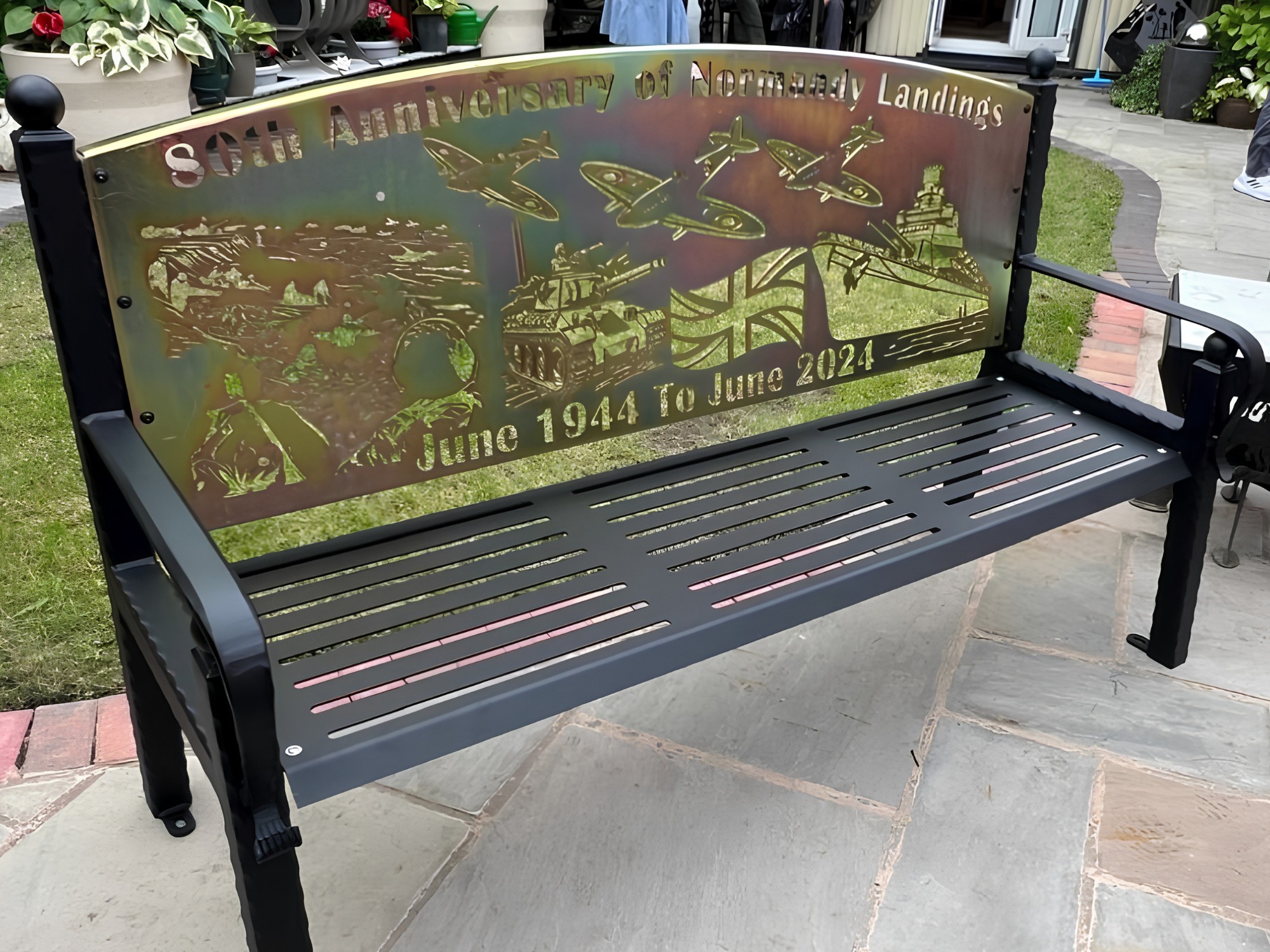 Veterans In Action memorial steel bench with laser‑cut soldier and crest design