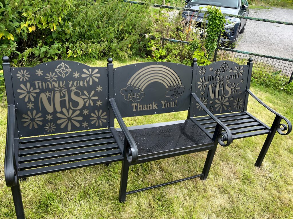 Laser‑cut steel bench with Welsh Rugby Union dragon design