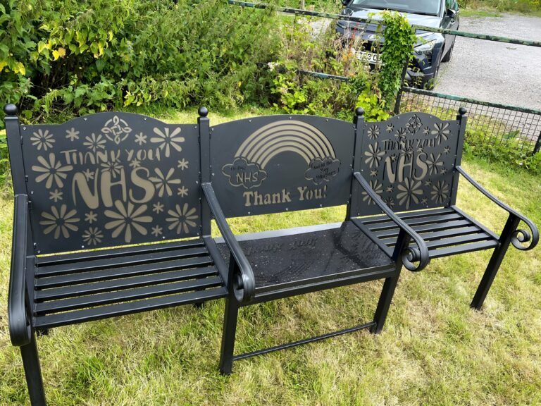 Laser‑cut steel bench with Welsh Rugby Union dragon design