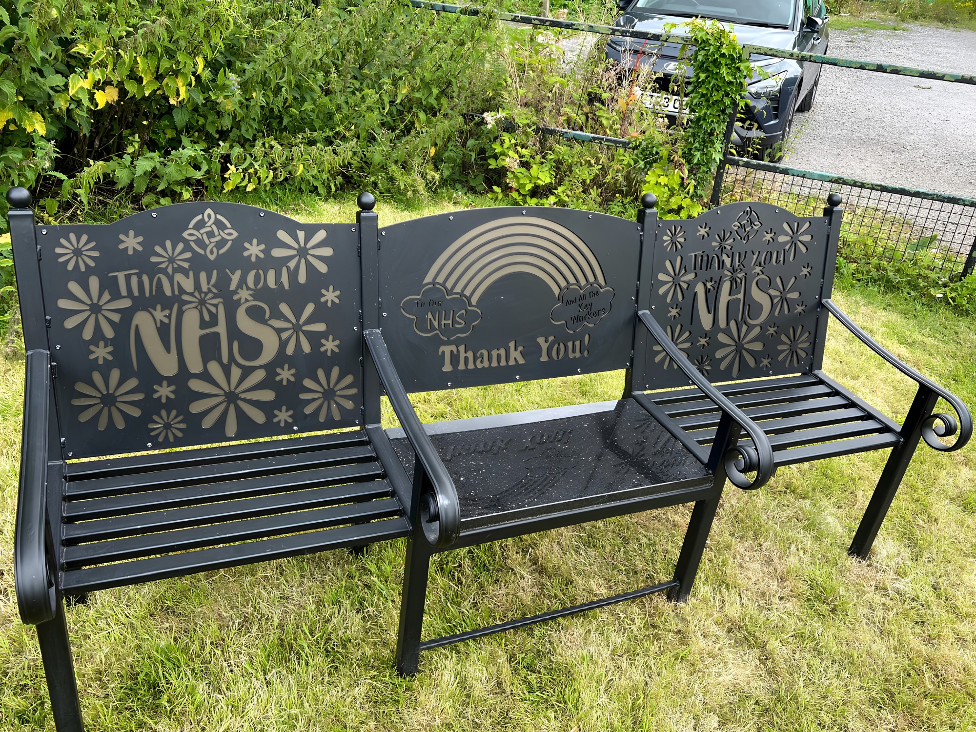 Laser‑cut steel bench with Welsh Rugby Union dragon design