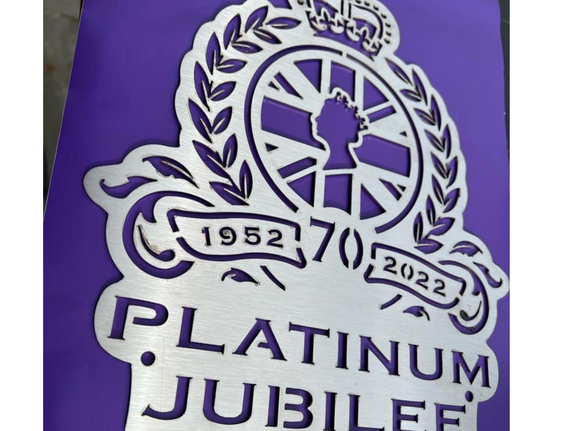 Laser‑cut steel Platinum Jubilee emblem with crown, laurel wreath and 70‑year design