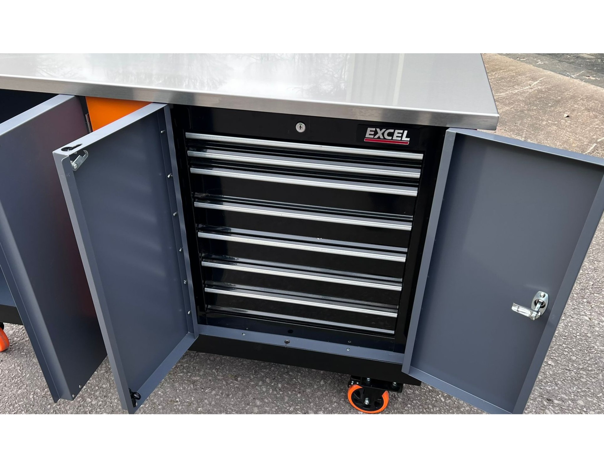 EXCEL tool cabinet with stainless steel top and six black drawers on caster wheels